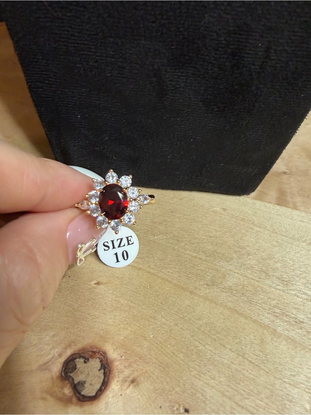 Gold-Tone Floral Ring with Garnet-Red Center and Clear Accents - Size 10